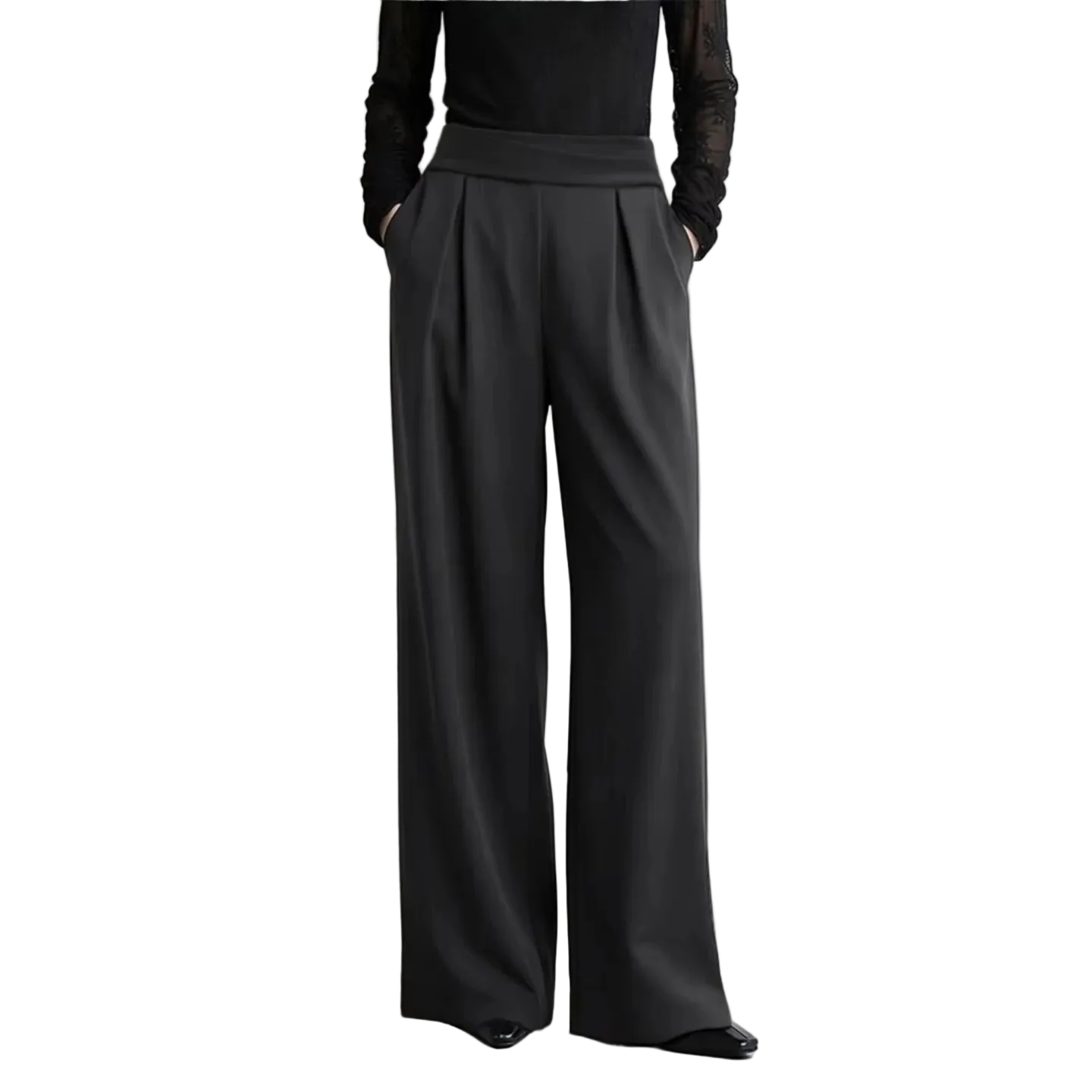 A model from the chest down wearing black wide-leg trousers with a matching black long-sleeve top, standing against a light gray wall. The AMII brand logo is visible in the top left, along with a text callout about wrinkle-resistant fabric.